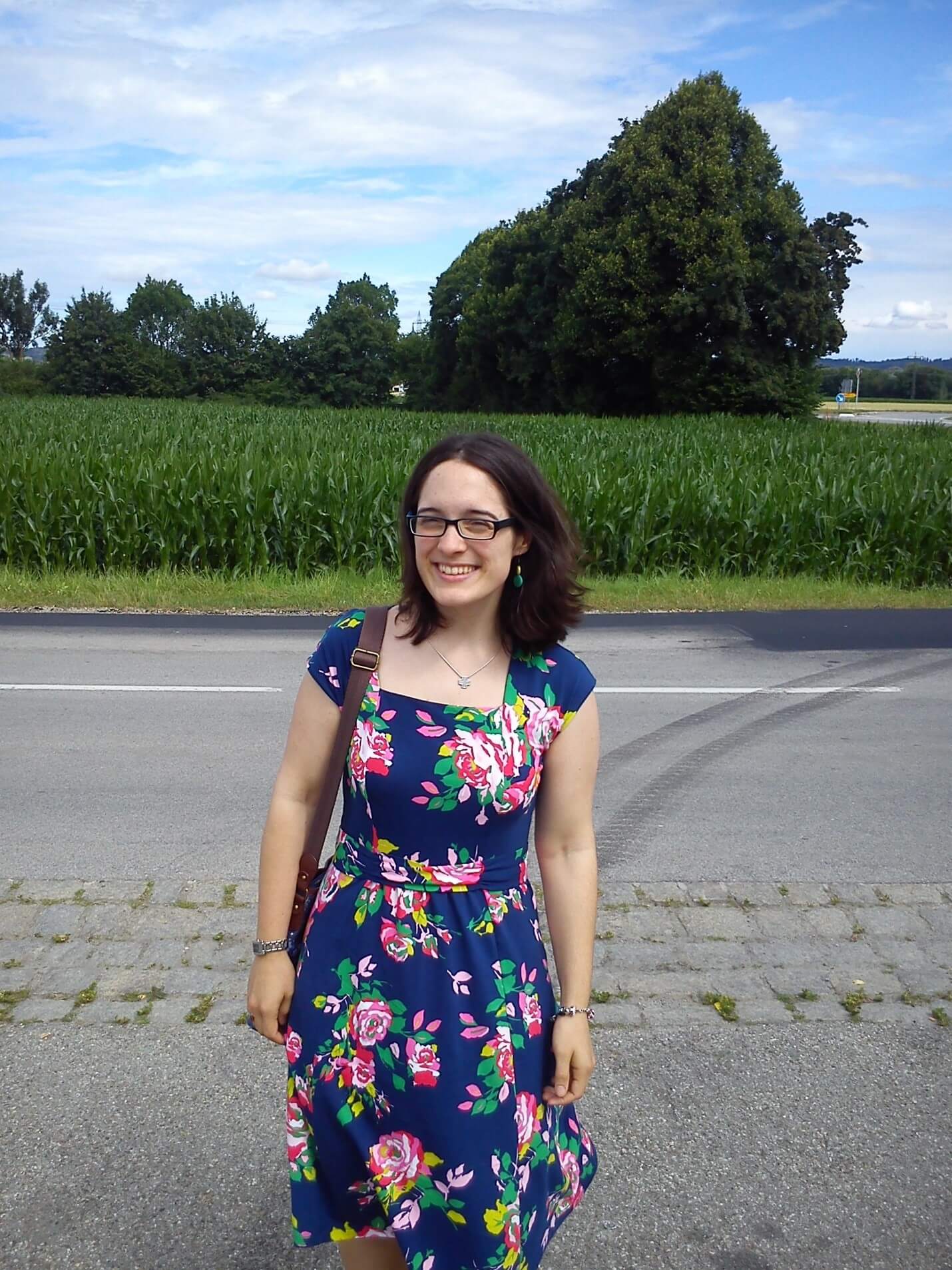 Lara von Detten smiling at the side of a road.