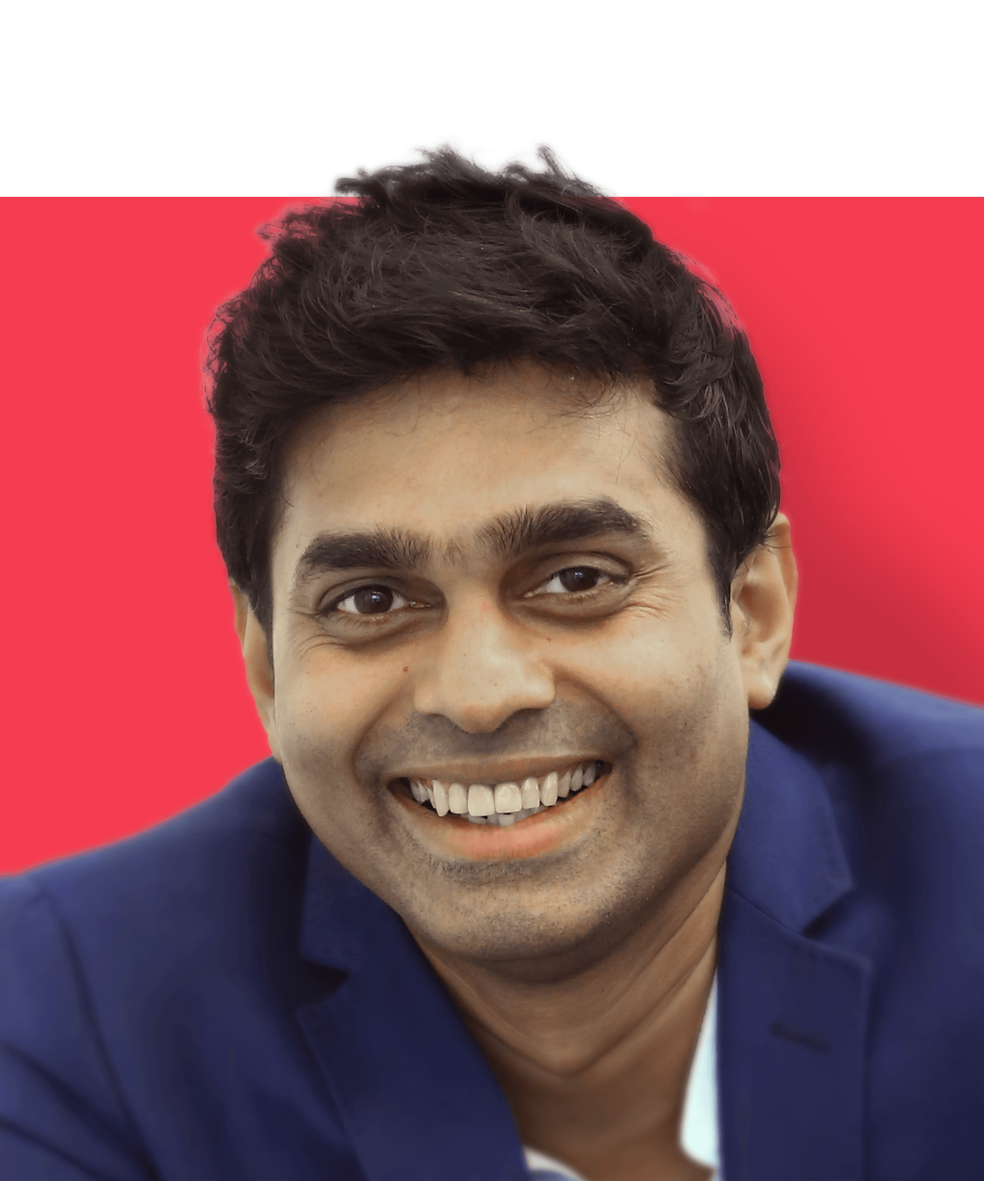Head shot of Managing Director of India Shashikant Someshwar (Shashi). He is an Indian man with short dark hair and brown eyes. He is wearing a dark blue jacket as he smiles at the camera.